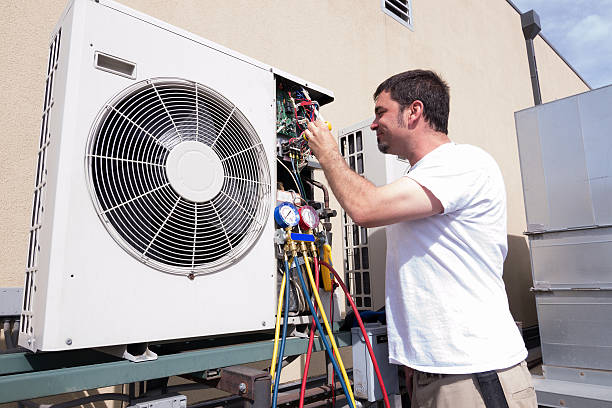 a technician fixing a non working air conditioner